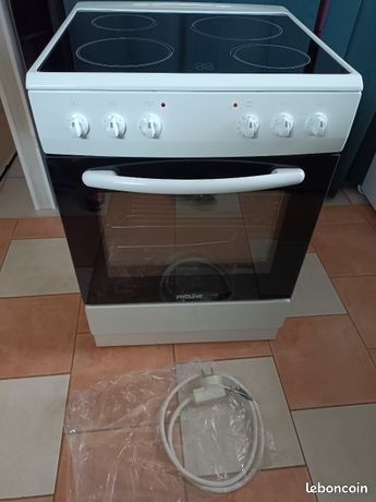 Cuisinière 4 feux vitrocéramique+ four électrique