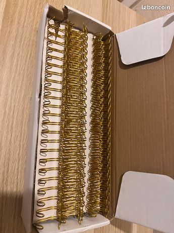 Spirale métallique dorée pour reliure