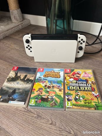 Switch oled blanche en parfait état + 3 jeux